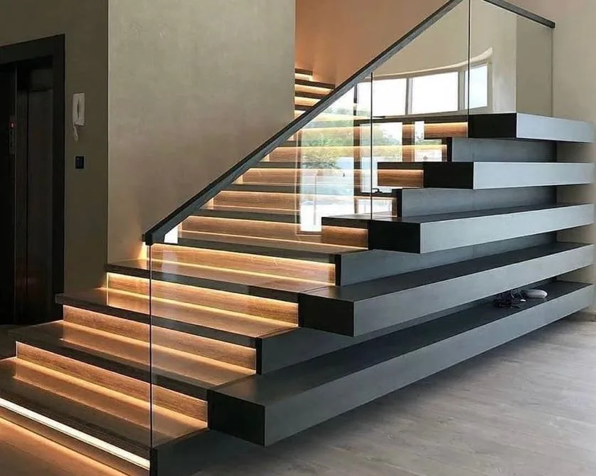 Aluminium straight staircase with structural glass railing in a modern interior