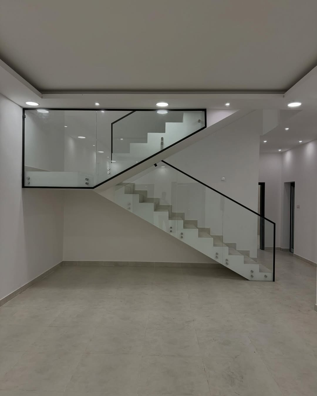 Modern floating stairs with glass staircase railings and aluminium base channel