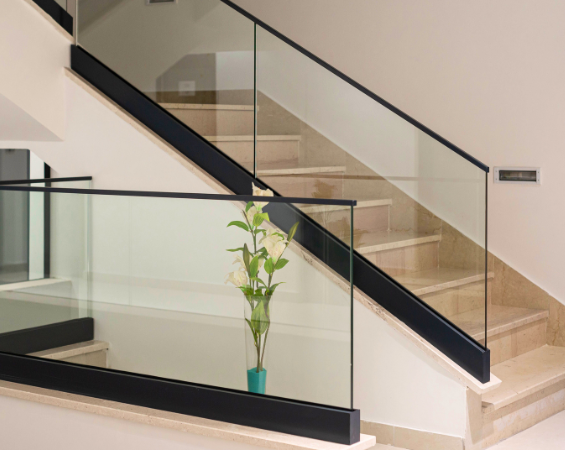 Steel and aluminium floating staircase with heavy-duty glass balustrade