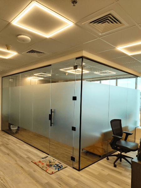 Frameless office glass room partition forming modern executive meeting cabins