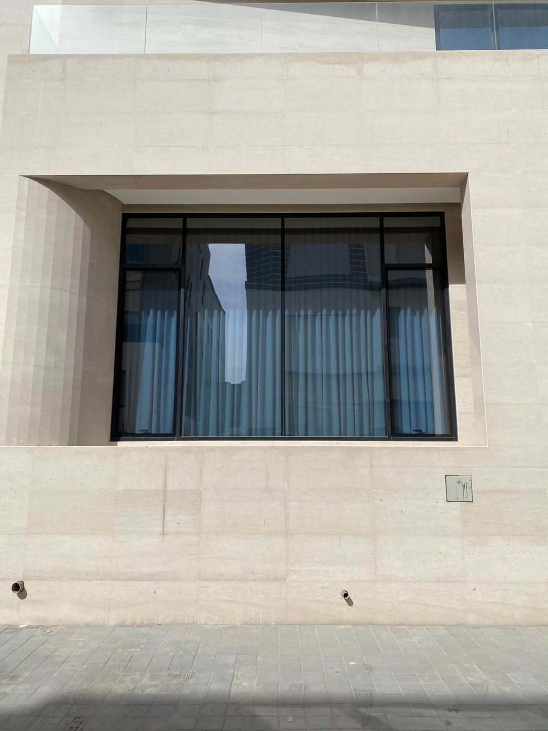 Thermal break aluminium casement windows installed on a modern architectural building