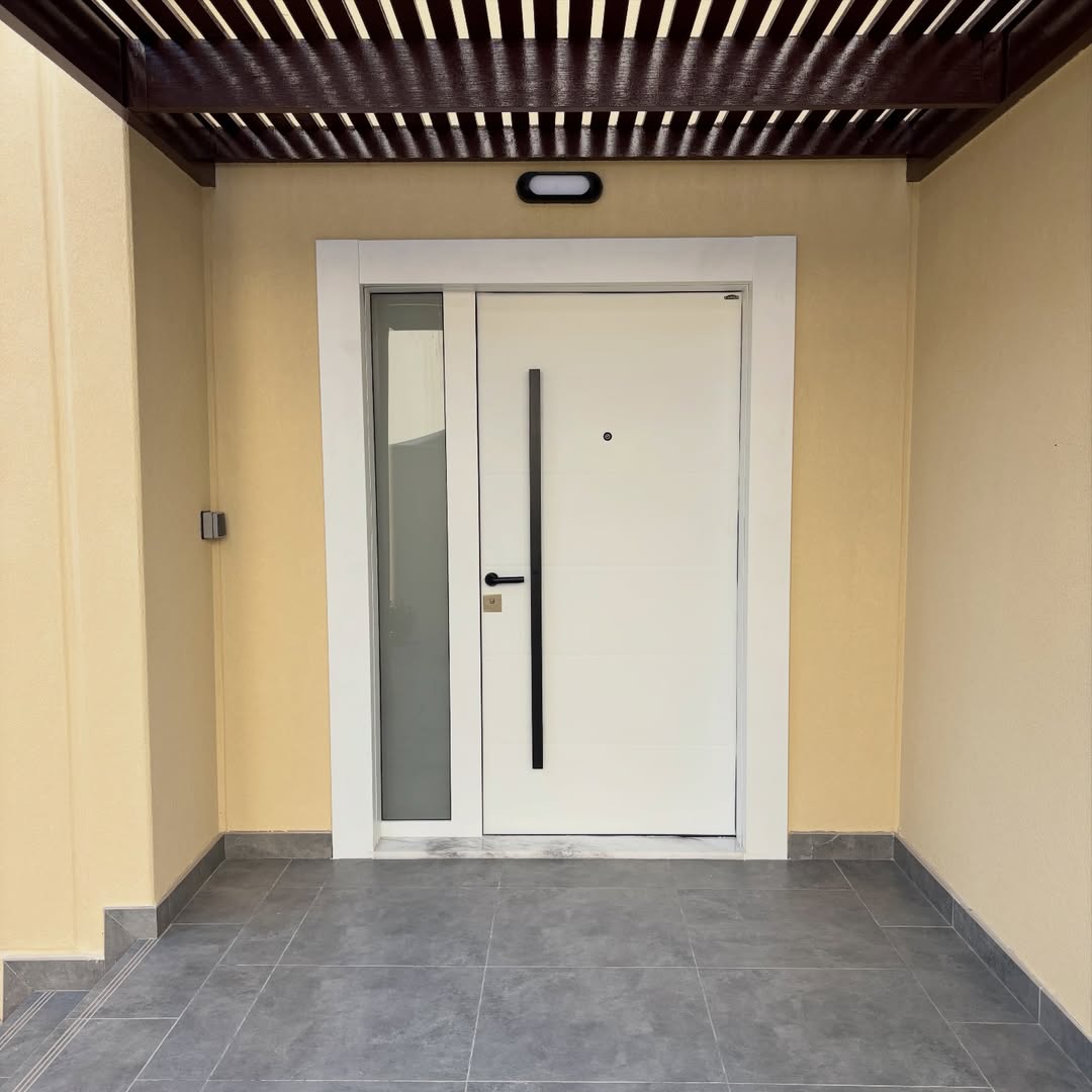 Automatic glass door shopfront installation with custom powder coated extrusions
